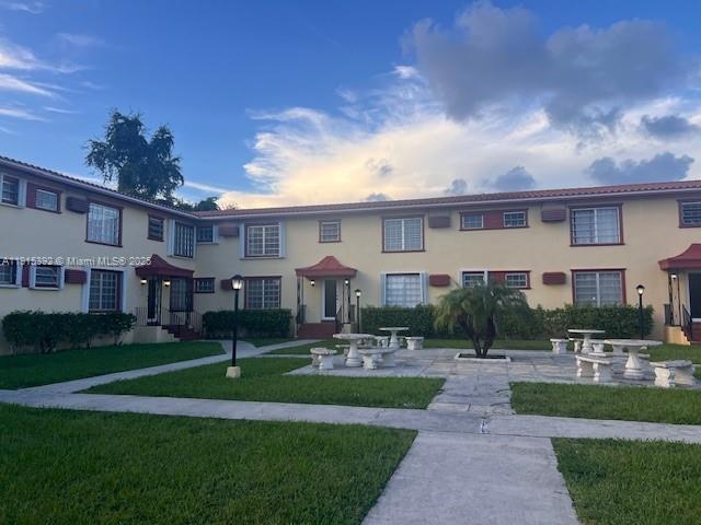 651 Southwest 11th Street, Unit 15W Miami, FL 33129 - Photo 23 of 24 a front view of house with yard and green space