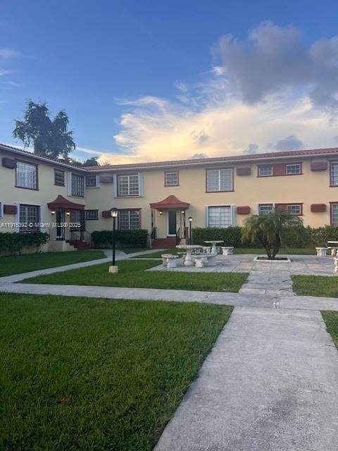 651 Southwest 11th Street, Unit 15W Miami, FL 33129 - Photo 24 of 24 a front view of house with yard and green space