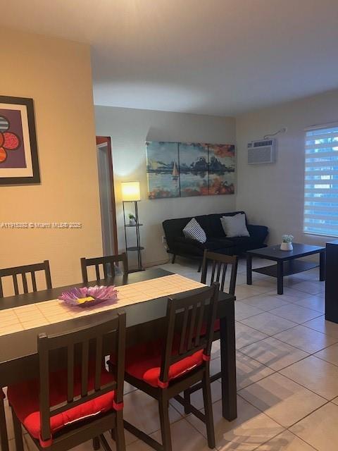 651 Southwest 11th Street, Unit 15W Miami, FL 33129 - Photo 5 of 24 a dining room with a wooden table and chairs