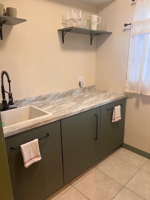 651 Southwest 11th Street, Unit 15W Miami, FL 33129 - Photo 9 of 24 a kitchen with a sink and cabinets