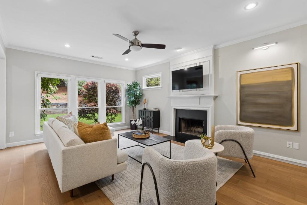 2120 Traywick Chase Alpharetta, GA 30004 - Photo 19 of 54 a living room with furniture a fireplace and a flat screen tv