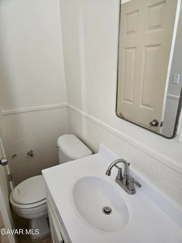 a bathroom with a sink and a toilet