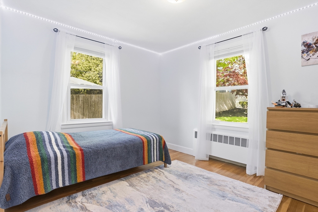 115 Collincote Street Stoneham, MA 02180 - Photo 13 of 25 a bedroom with a bed and a window
