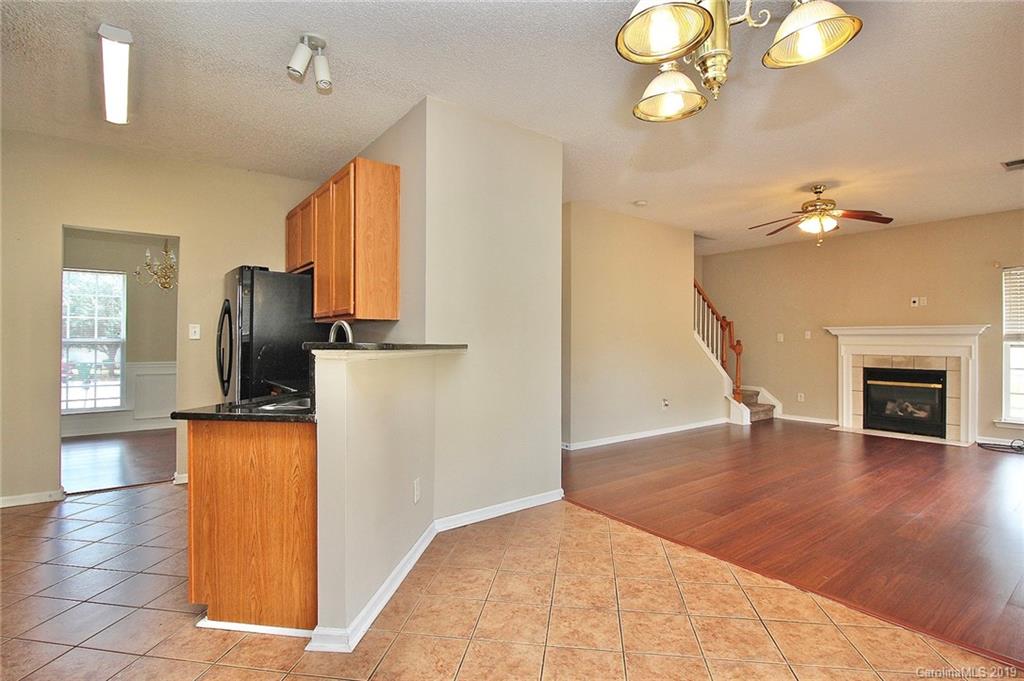 8207 Fox Swamp Road Charlotte, NC 28215 - Photo 16 of 44 an entryway with wooden floor and livingroom view