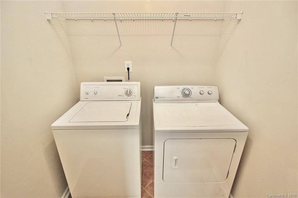 8207 Fox Swamp Road Charlotte, NC 28215 - Photo 18 of 44 a utility room with dryer and washer