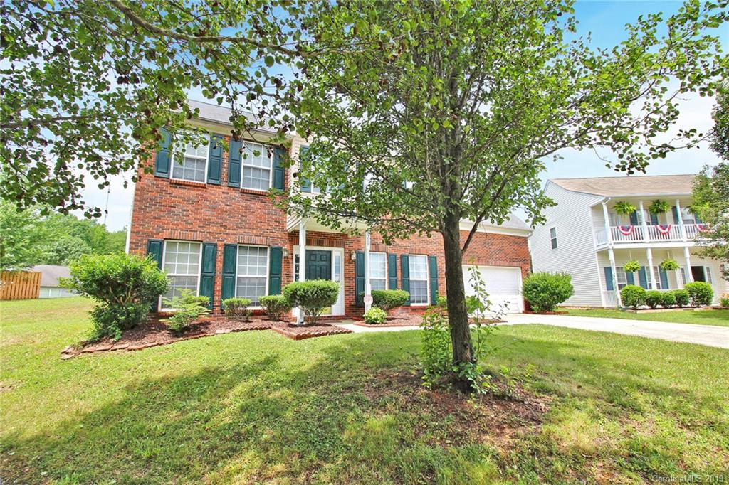 8207 Fox Swamp Road Charlotte, NC 28215 - Photo 3 of 44 a front view of a house with yard and green space