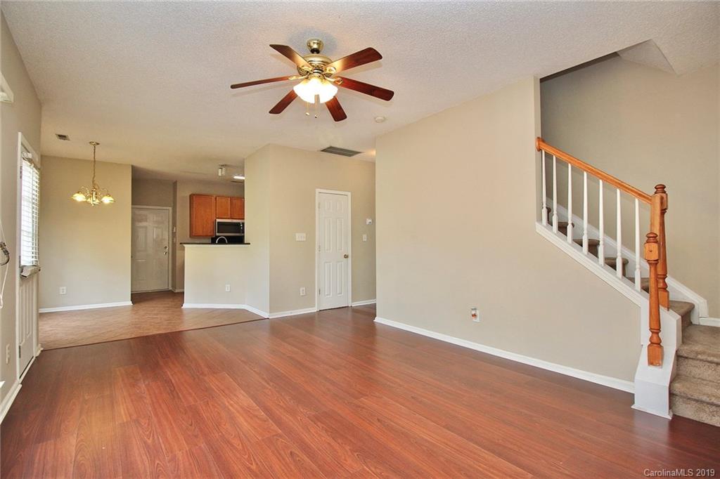 8207 Fox Swamp Road Charlotte, NC 28215 - Photo 21 of 44 wooden floor in an empty room with a window