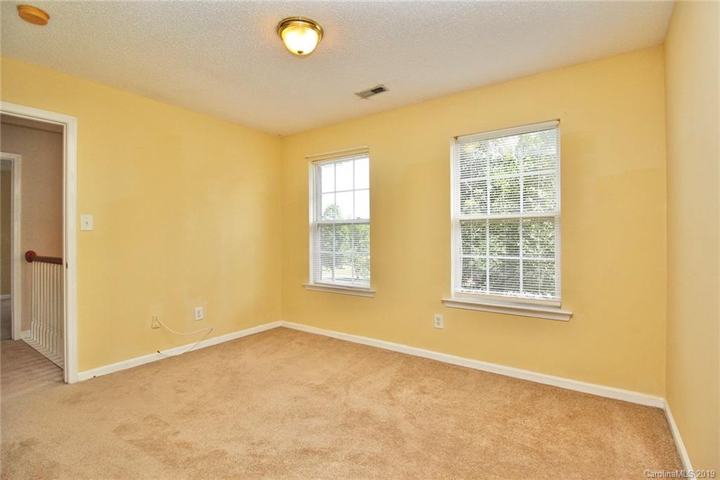 8207 Fox Swamp Road Charlotte, NC 28215 - Photo 24 of 44 an empty room with windows