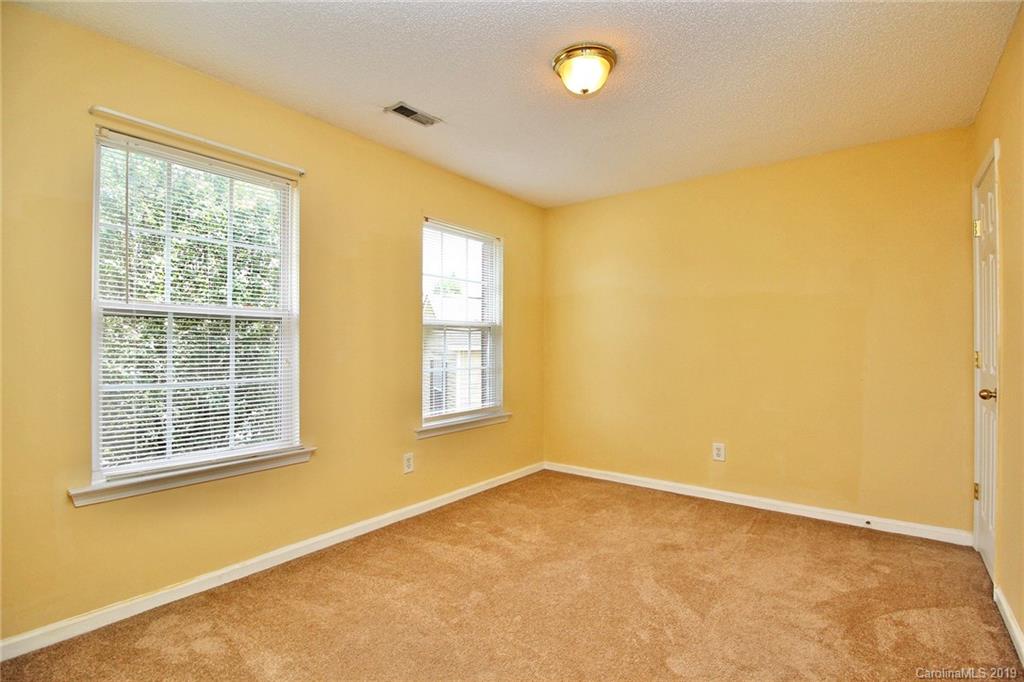 8207 Fox Swamp Road Charlotte, NC 28215 - Photo 25 of 44 a view of an empty room with a window