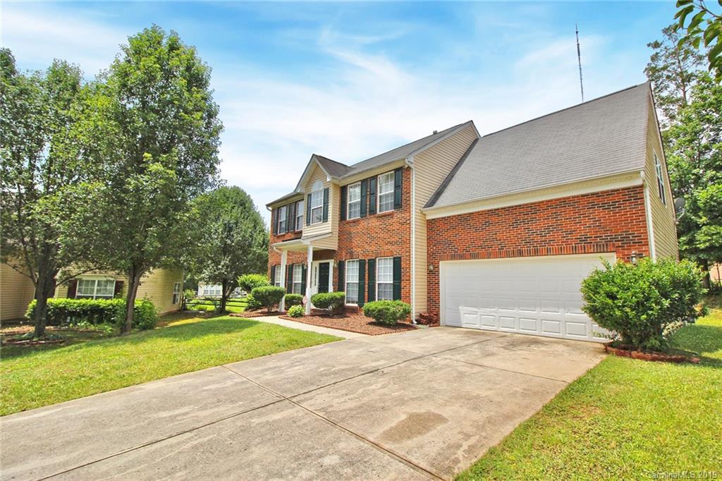 8207 Fox Swamp Road Charlotte, NC 28215 - Photo 4 of 44 a front view of a house with a yard