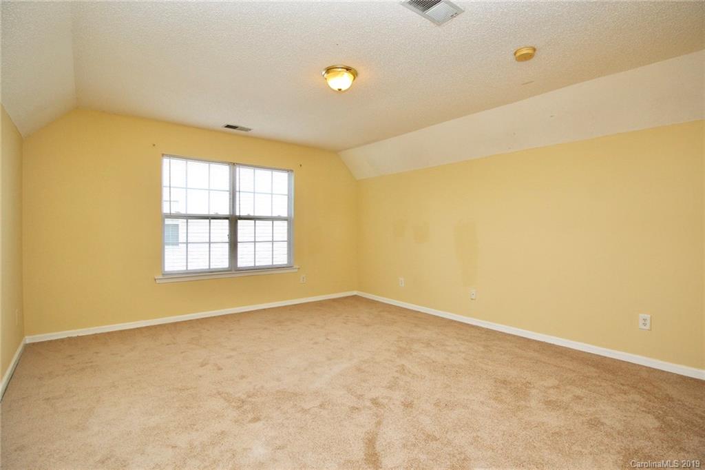 8207 Fox Swamp Road Charlotte, NC 28215 - Photo 32 of 44 an empty room with windows