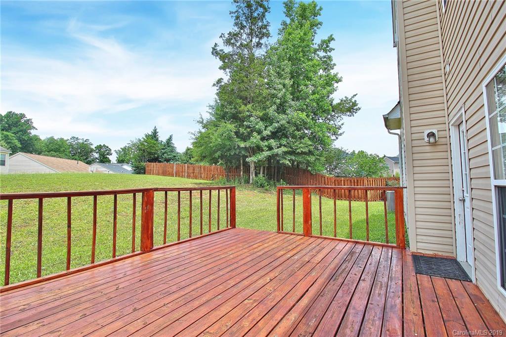 8207 Fox Swamp Road Charlotte, NC 28215 - Photo 37 of 44 a view of wooden deck and a garden