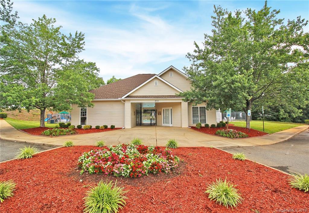 8207 Fox Swamp Road Charlotte, NC 28215 - Photo 42 of 44 a front view of a house with a yard
