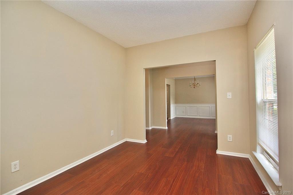 8207 Fox Swamp Road Charlotte, NC 28215 - Photo 8 of 44 a view of wooden floor in an empty room