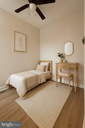 a bedroom with a bed furniture and wooden floor