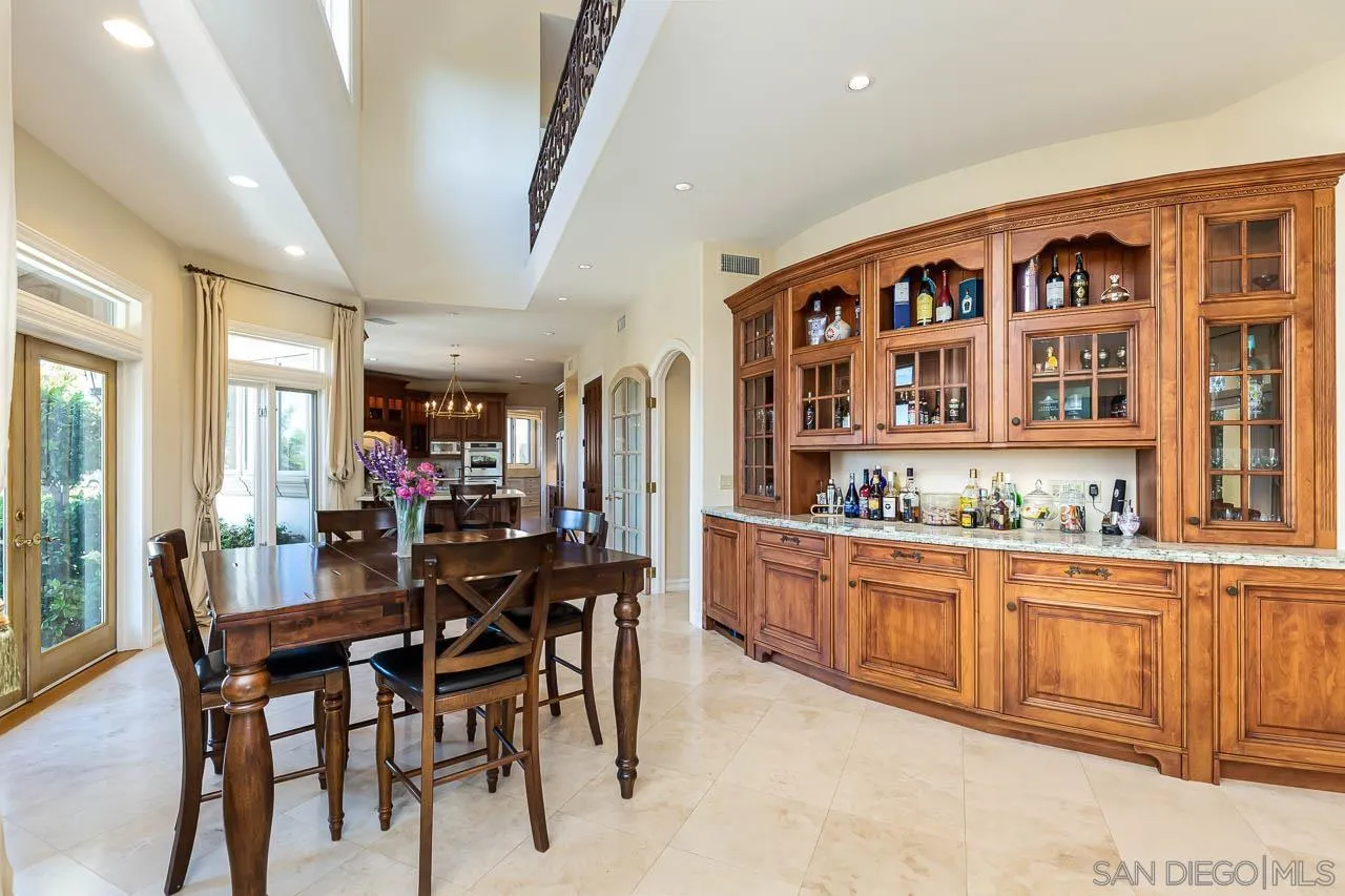 14440 Ridge Ranch Road Valley Center, CA 92082 - Photo 25 of 74 a view of a dining room with furniture and chandelier