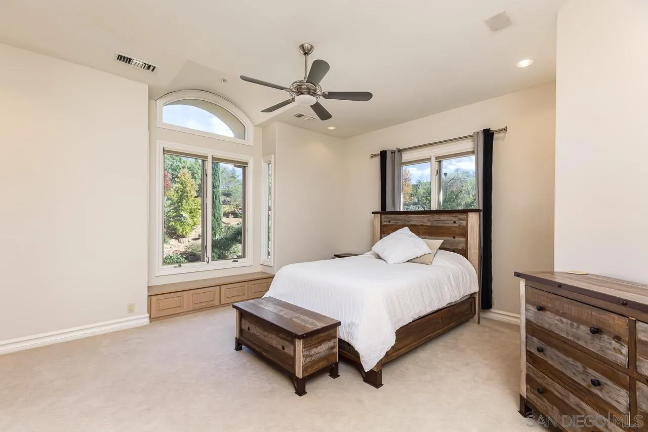 14440 Ridge Ranch Road Valley Center, CA 92082 - Photo 43 of 74 a bedroom with a bed and a window