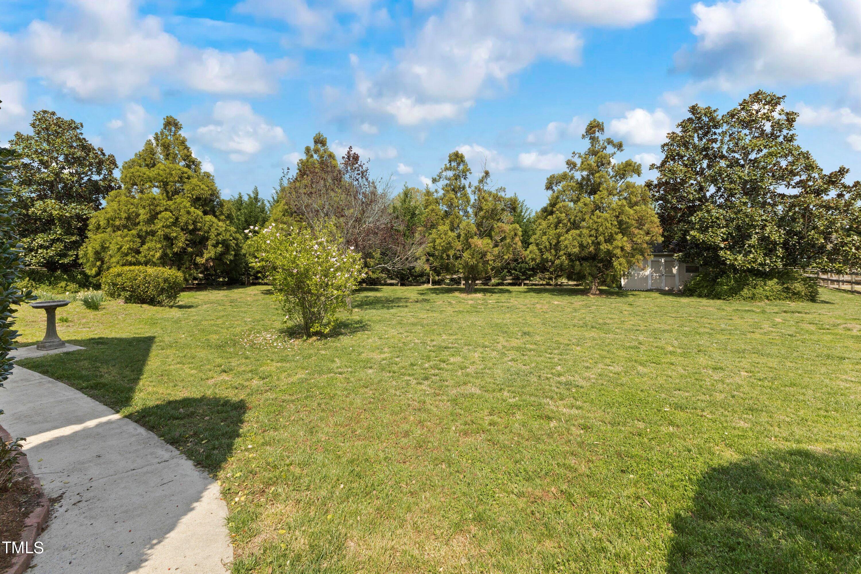 1004 Pasture View Lane Raleigh, NC 27603 - Photo 39 of 48 Lush and mature landscaping in the backyard.