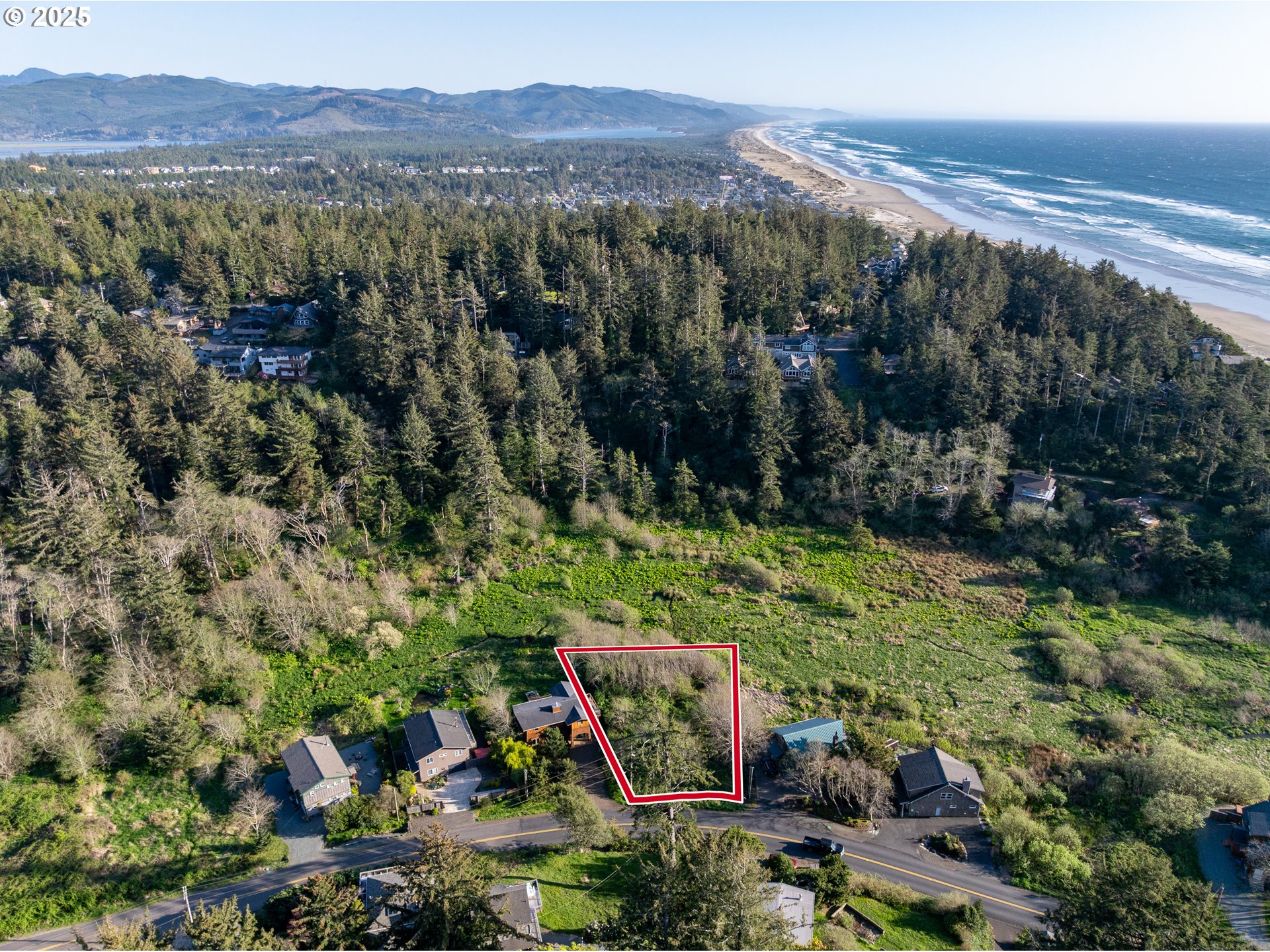 Nehalem Road Manzanita, OR 97130 - Photo 13 of 16 a view of a city with mountains in the background