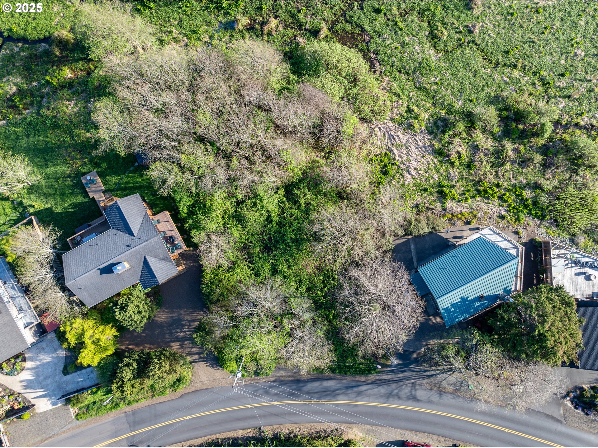 Nehalem Road Manzanita, OR 97130 - Photo 6 of 16 an aerial view of a house with yard and outdoor seating