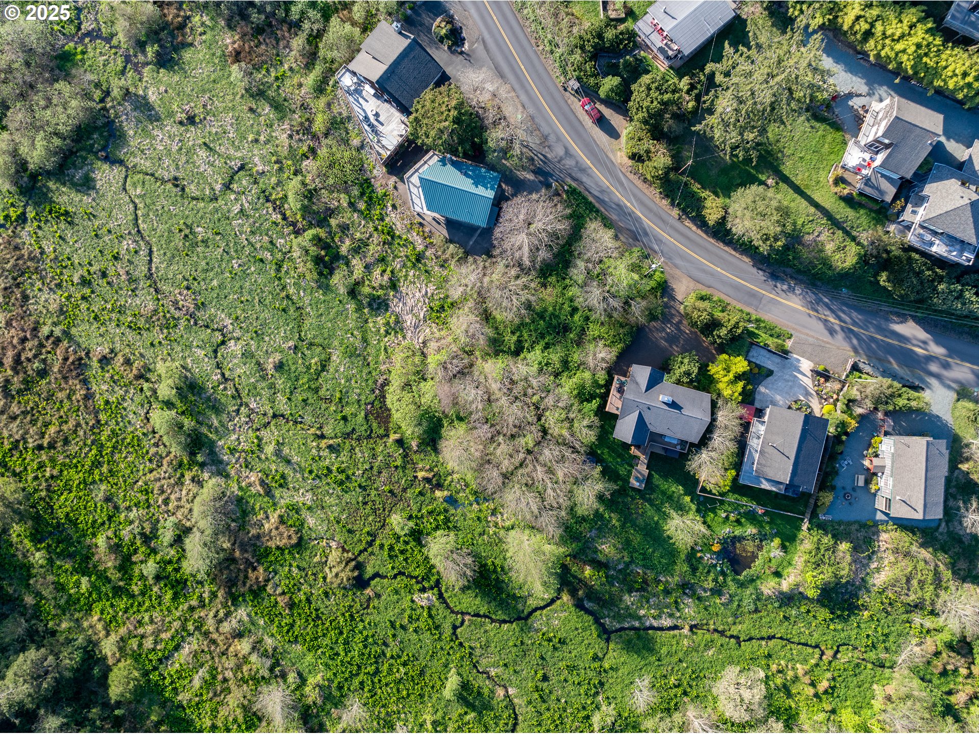 Nehalem Road Manzanita, OR 97130 - Photo 7 of 16 an aerial view of a house with a yard
