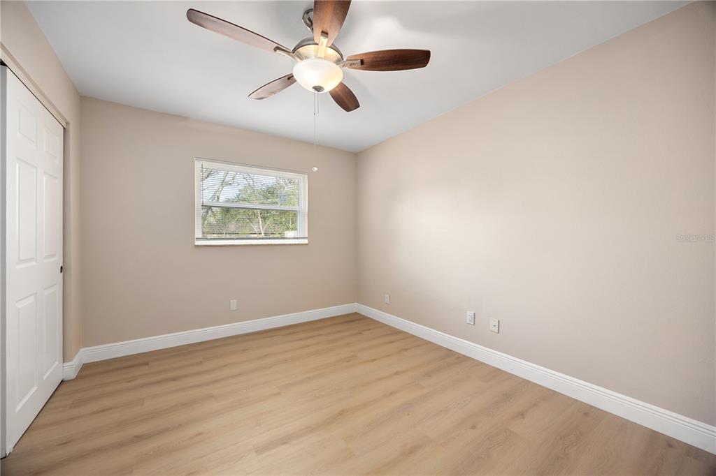 8013 Rhea Circle Orlando, FL 32807 - Photo 18 of 31 an empty room with a window and a fan