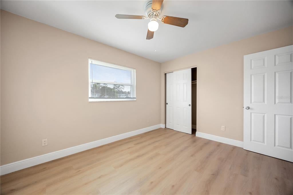 8013 Rhea Circle Orlando, FL 32807 - Photo 24 of 31 a view of an empty room with wooden floor