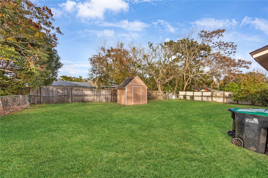 8013 Rhea Circle Orlando, FL 32807 - Photo 30 of 31 a view of a large garden with large trees