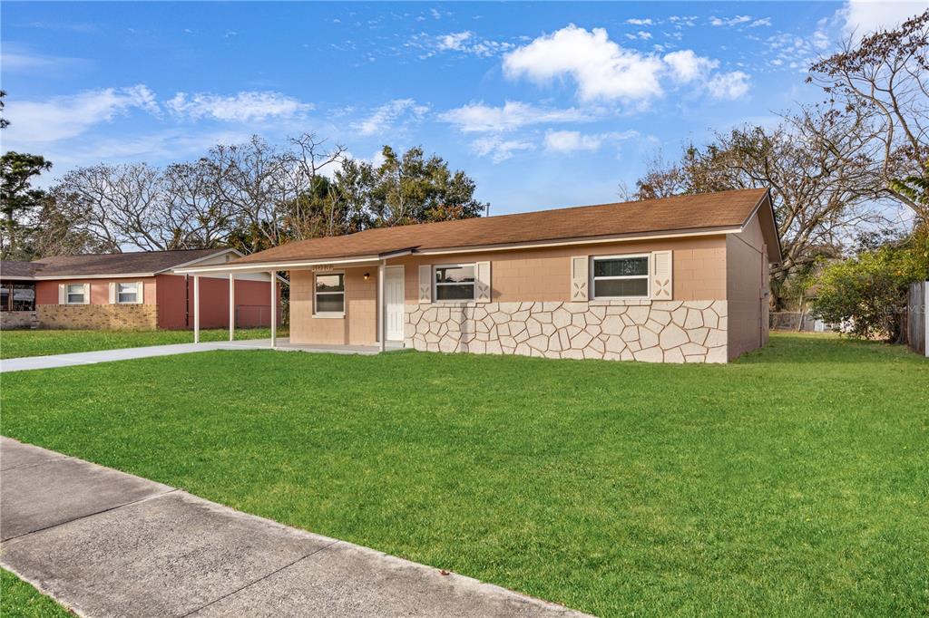 8013 Rhea Circle Orlando, FL 32807 - Photo 3 of 31 front view of a house with a yard