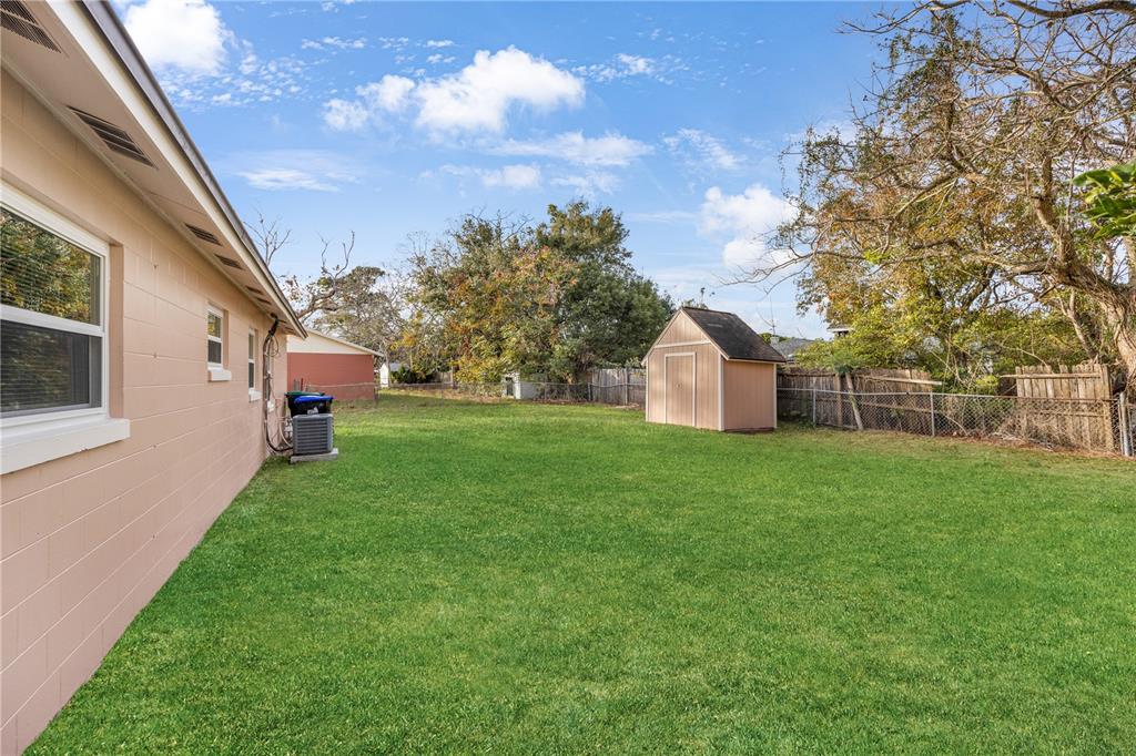 8013 Rhea Circle Orlando, FL 32807 - Photo 31 of 31 a front view of house with yard and trees