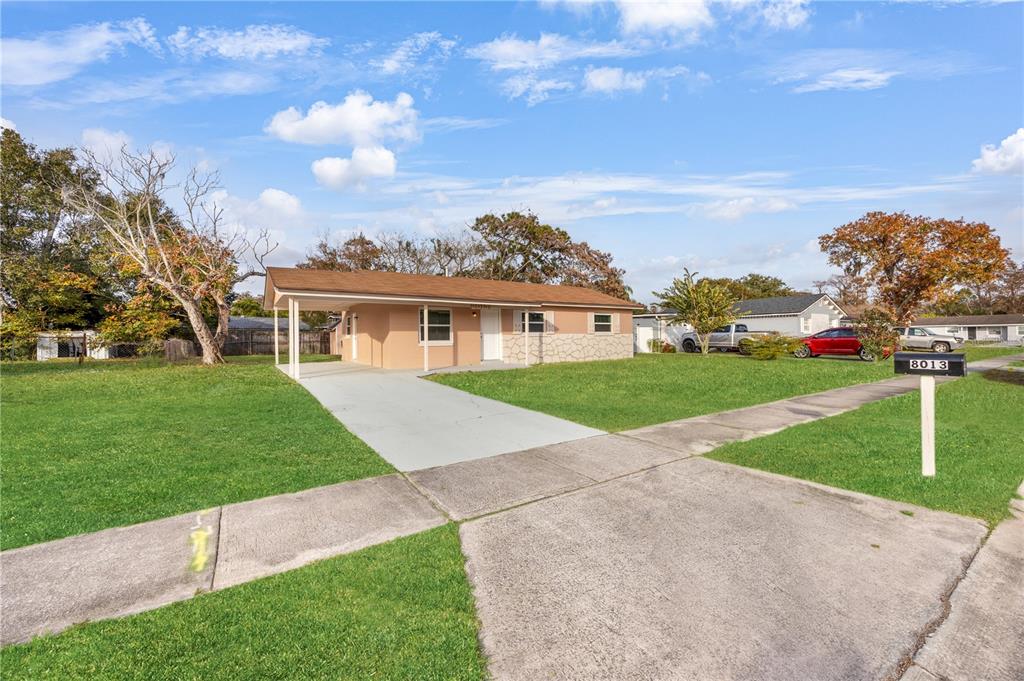 8013 Rhea Circle Orlando, FL 32807 - Photo 4 of 31 front view of a house with a yard