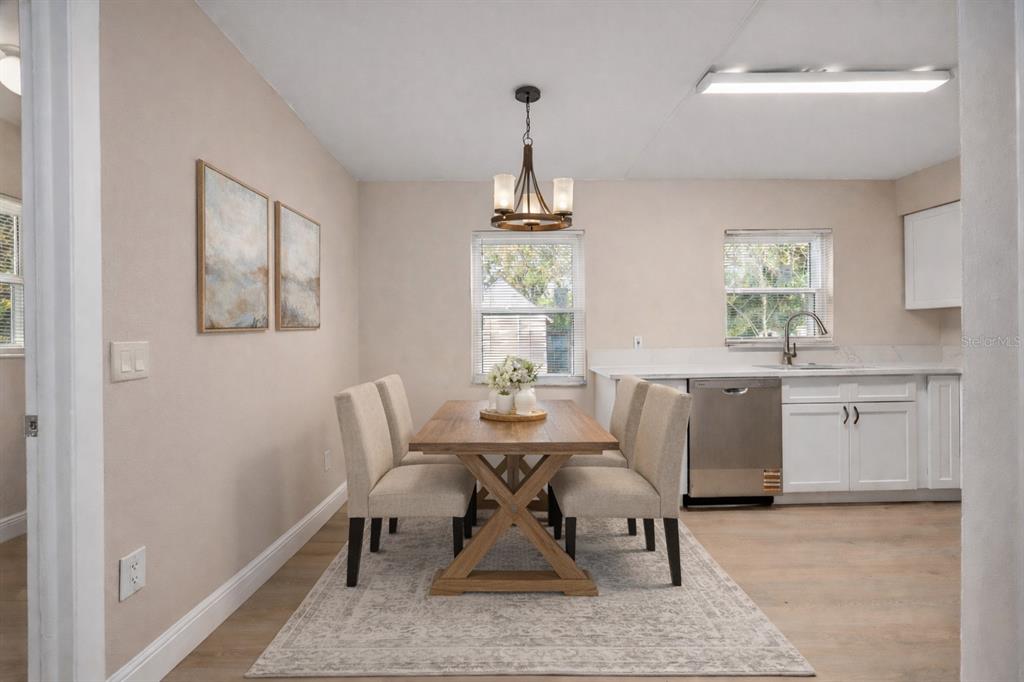 8013 Rhea Circle Orlando, FL 32807 - Photo 10 of 31 a view of a dining room with furniture window and wooden floor