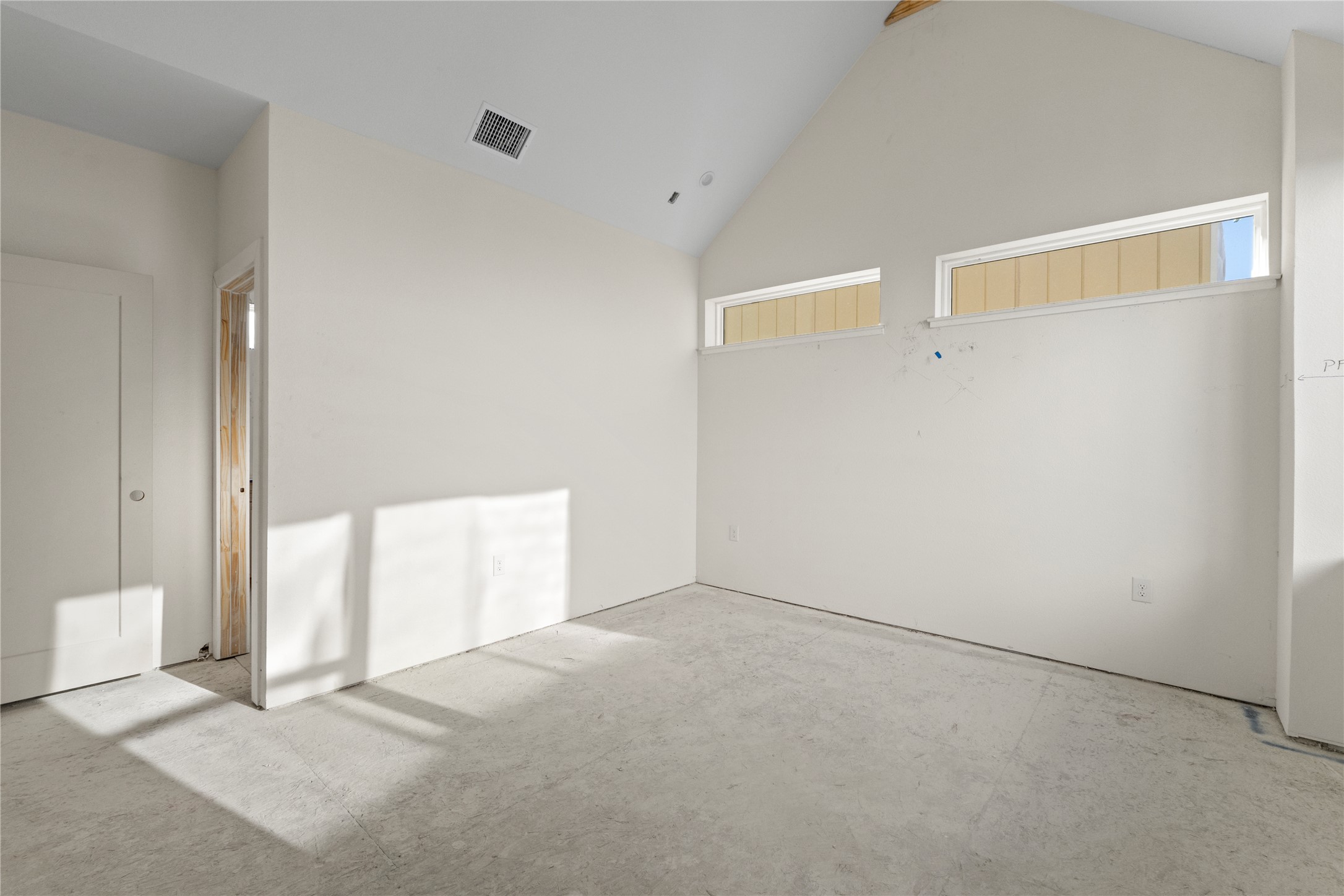 1180 Lott Avenue Austin, TX 78721 - Photo 13 of 40 Primary bedroom with high vaulted ceiling