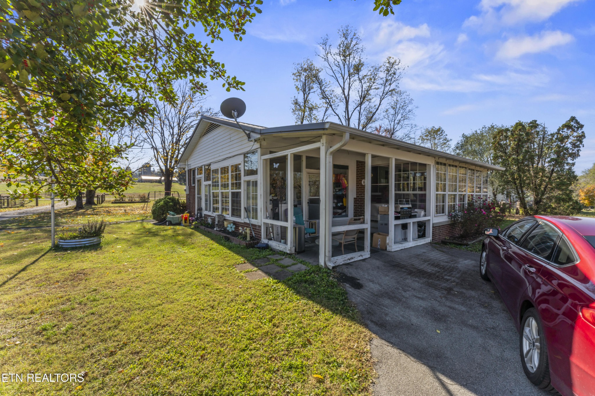3856 Niles Ferry Road Greenback, TN 37742 - Photo 12 of 44 a view of a house with backyard porch and sitting area