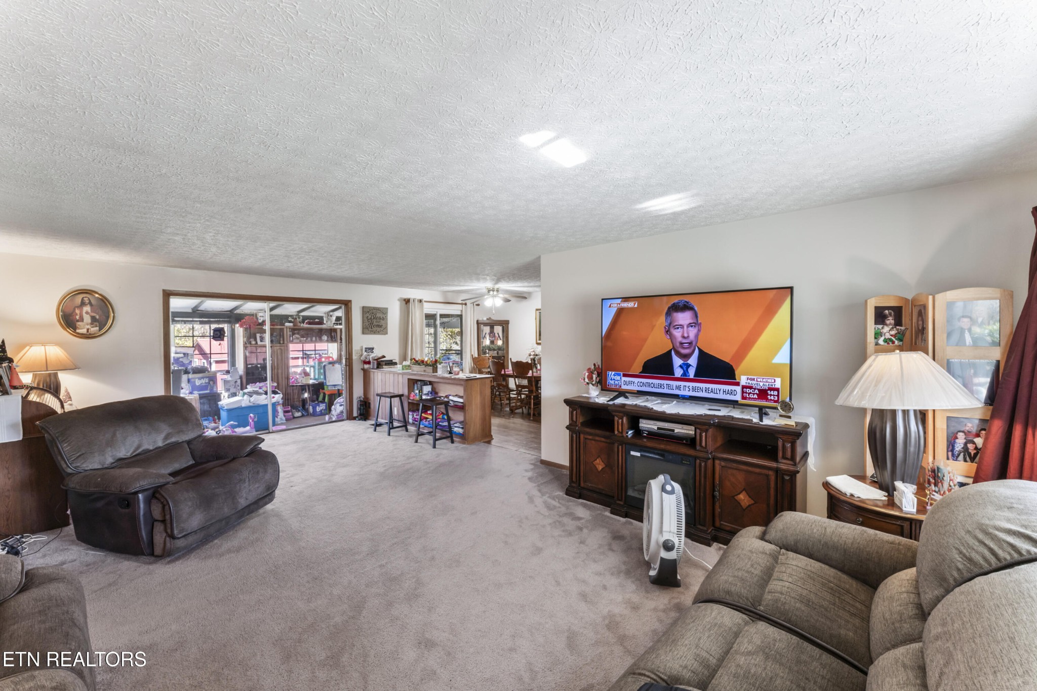 3856 Niles Ferry Road Greenback, TN 37742 - Photo 14 of 44 a living room with furniture and a flat screen tv