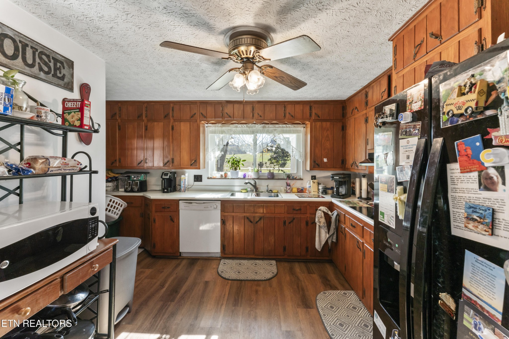 3856 Niles Ferry Road Greenback, TN 37742 - Photo 18 of 44 a kitchen with stainless steel appliances granite countertop a stove a sink dishwasher and a microwave oven with cabinets