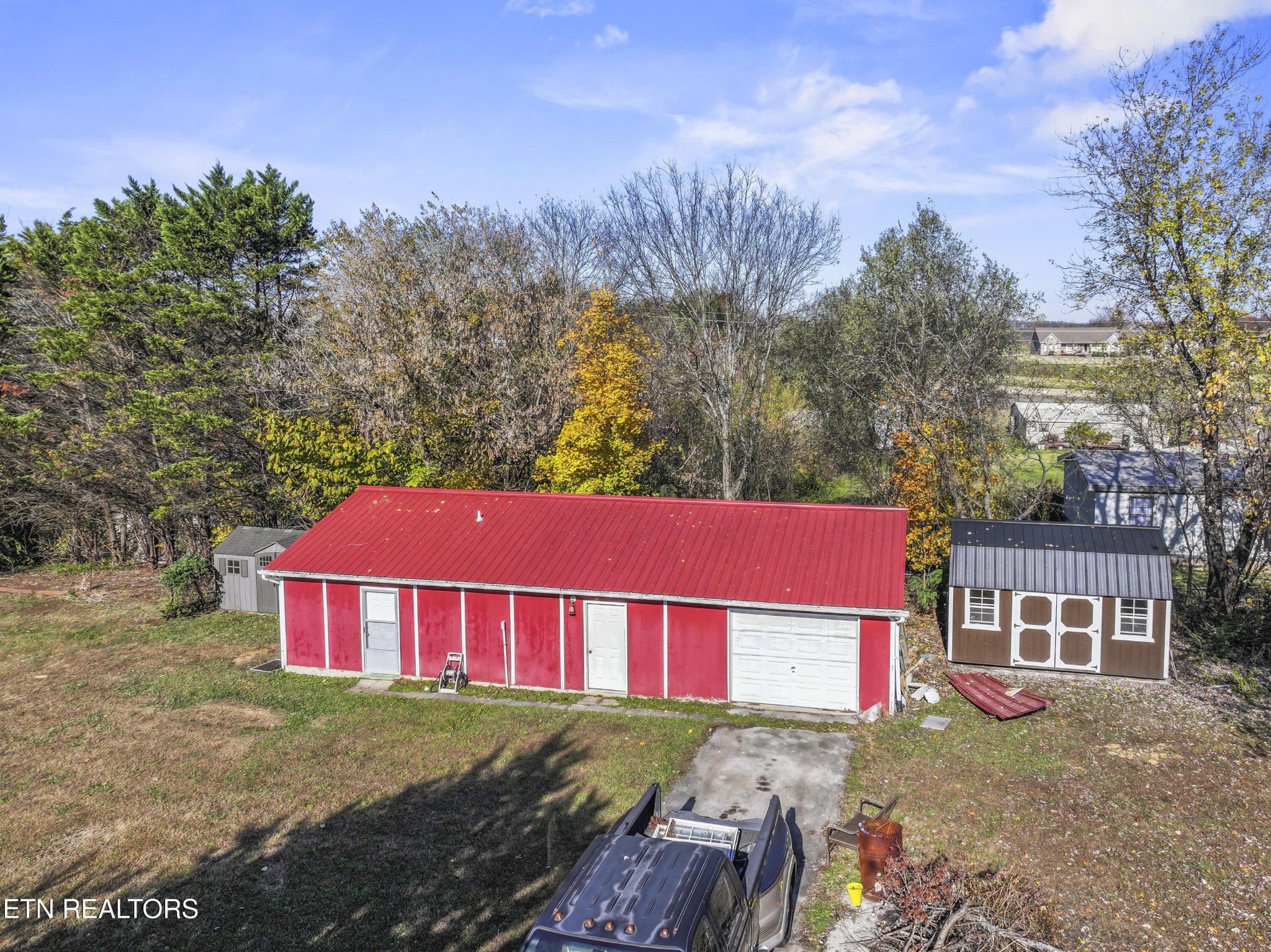3856 Niles Ferry Road Greenback, TN 37742 - Photo 23 of 44 a view of a big house with a big yard plants and large trees