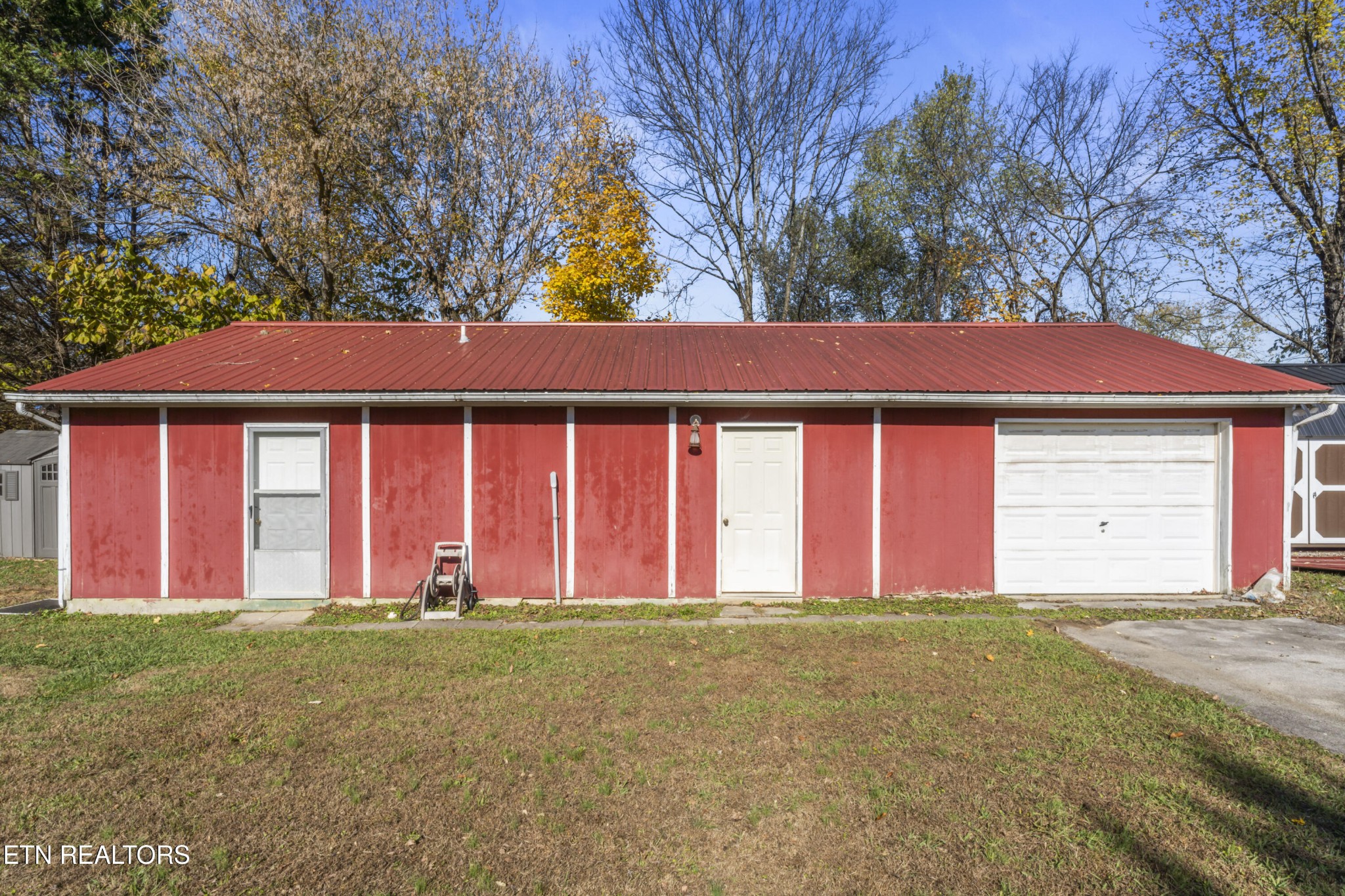 3856 Niles Ferry Road Greenback, TN 37742 - Photo 32 of 44 a view of a house with a yard and garage