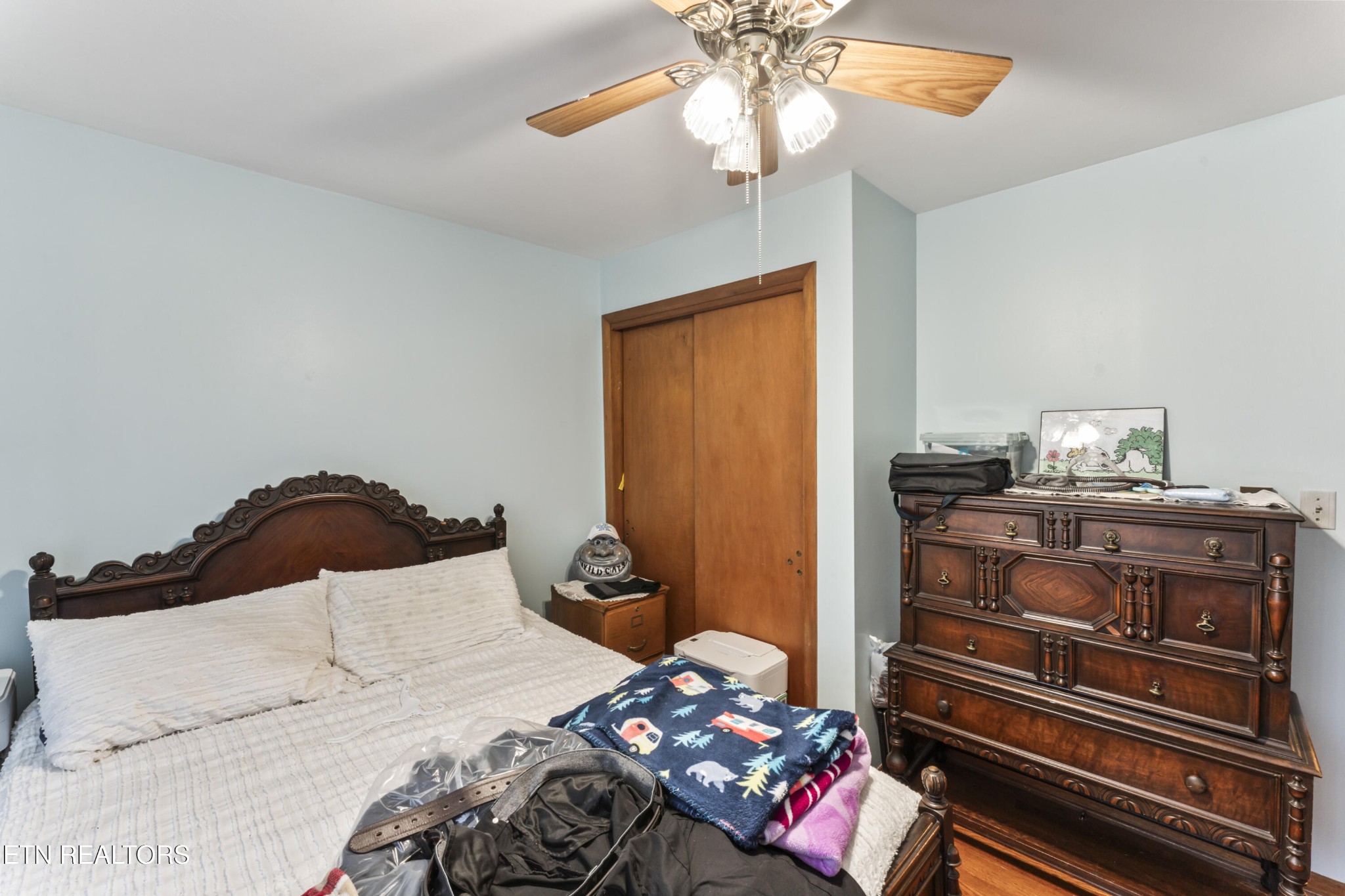 3856 Niles Ferry Road Greenback, TN 37742 - Photo 39 of 44 a bedroom with a bed and wooden floor