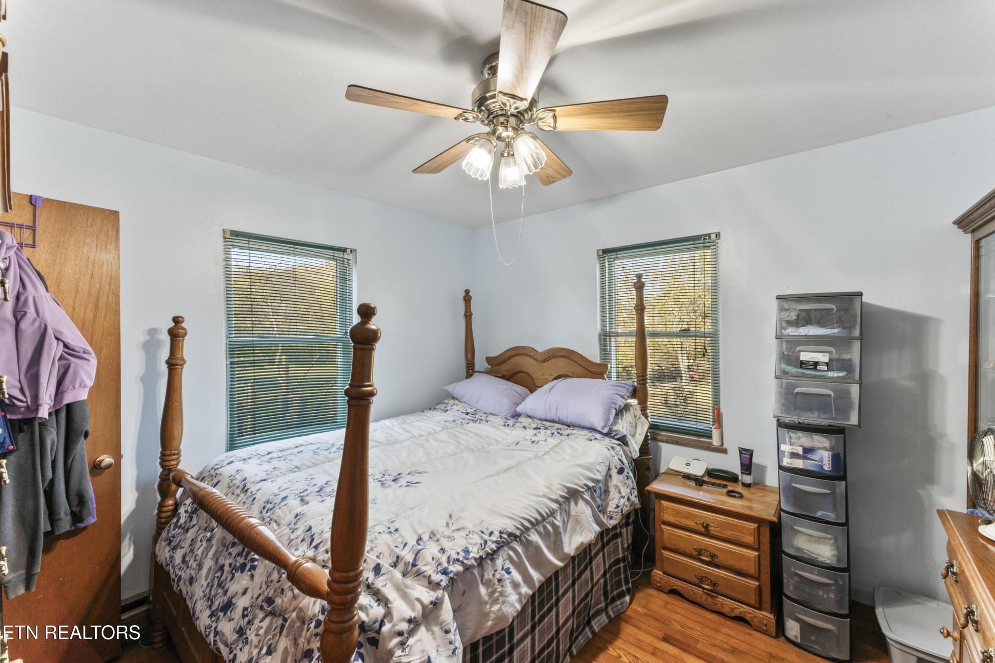 3856 Niles Ferry Road Greenback, TN 37742 - Photo 40 of 44 a bedroom with a bed and a chandelier