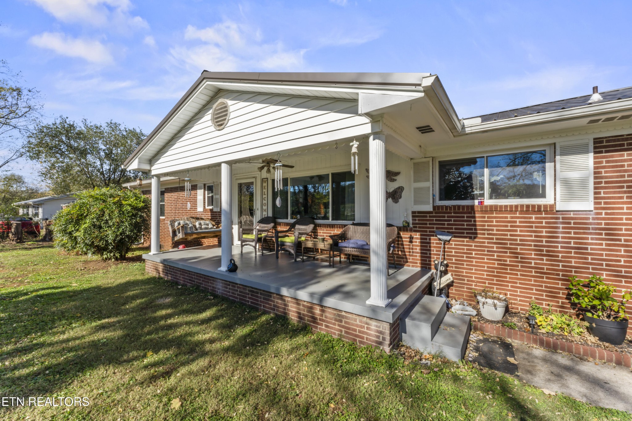 3856 Niles Ferry Road Greenback, TN 37742 - Photo 6 of 44 a view of a house with backyard porch and sitting area