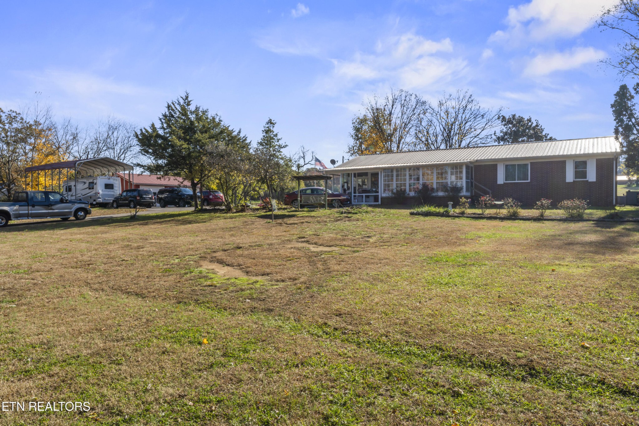 3856 Niles Ferry Road Greenback, TN 37742 - Photo 7 of 44 a view of a house with a yard and car parked