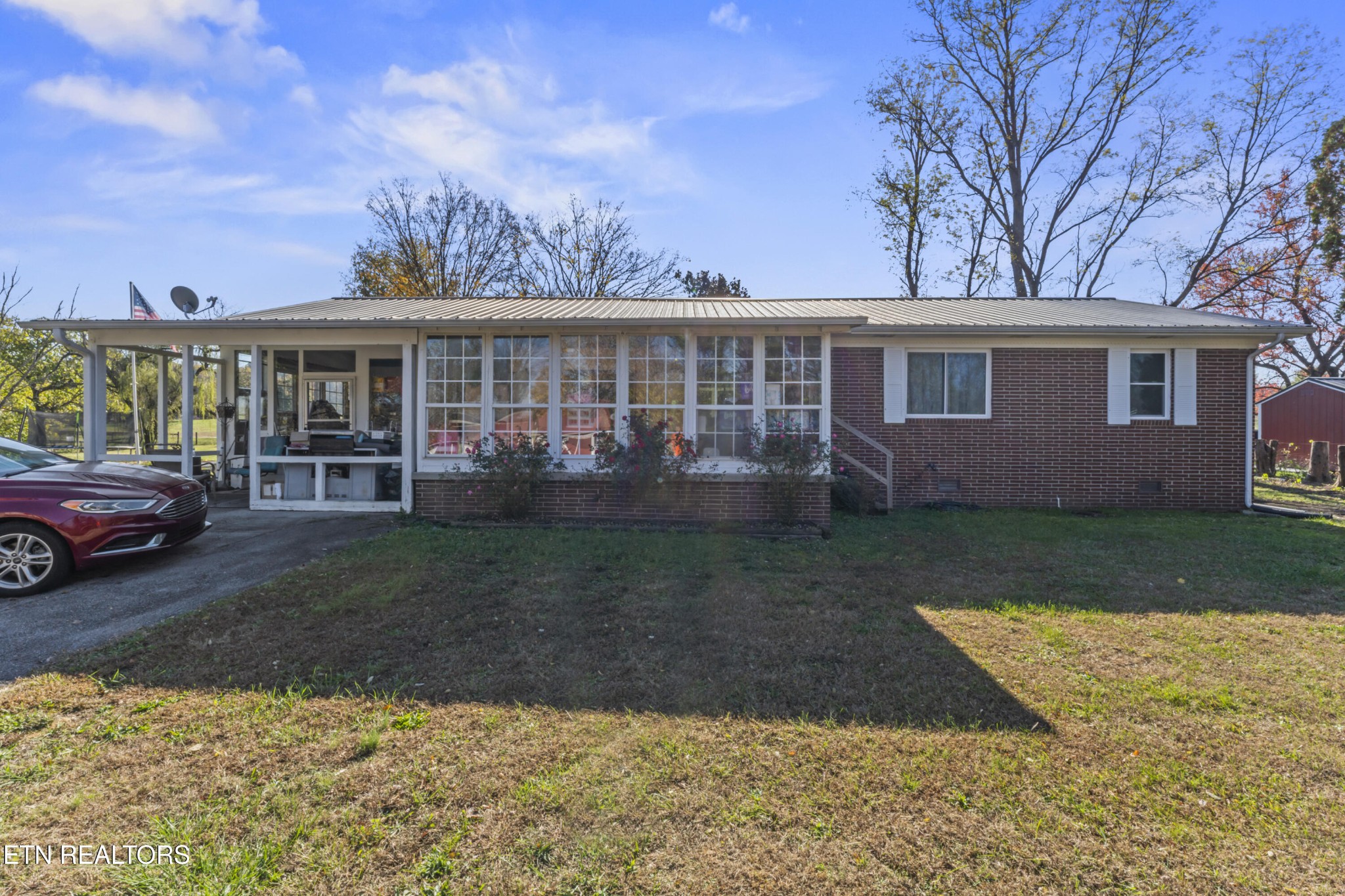 3856 Niles Ferry Road Greenback, TN 37742 - Photo 8 of 44 a view of a house with a yard