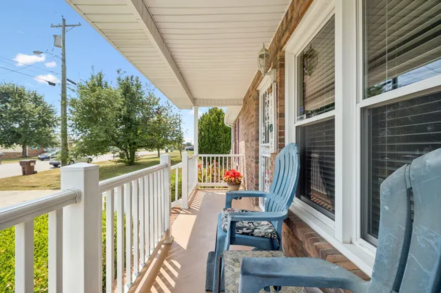 a view of a porch with furniture