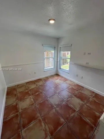 a view of a backyard with pathway