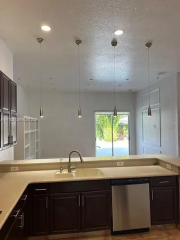 a kitchen with a sink and window