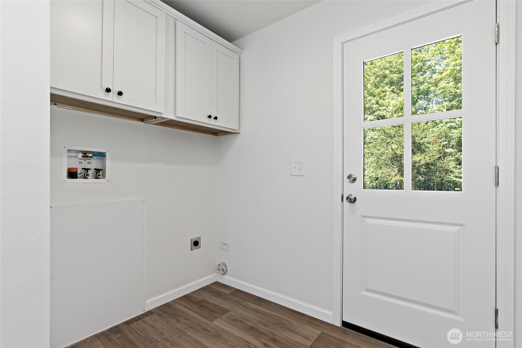 17217 80th Street Southwest Longbranch, WA 98351 - Photo 32 of 39 a view of cabinets and wooden floor