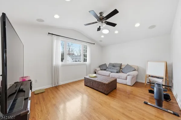 a bed room with a bed and a chair