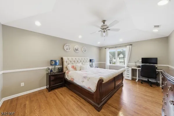 a large bathroom with a toilet a sink and a mirror