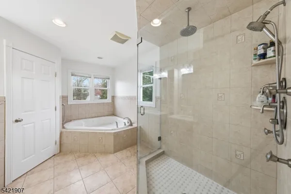 a bedroom with bed and wooden floor